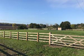 wooden property fence around field