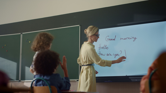 teacher using interactive digital whiteboard